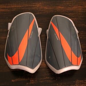 Nike Dark Gray and Bright Orange Left & Right Shin Guards